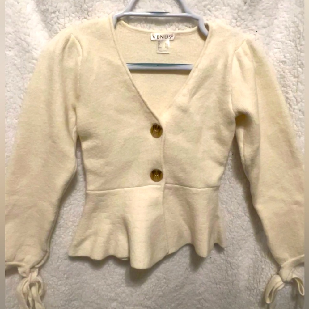 Beautiful peplum style sweater top